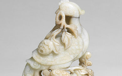 A PALE GREEN JADE 'PHOENIX AND PEONY' GROUP 17th/18th century