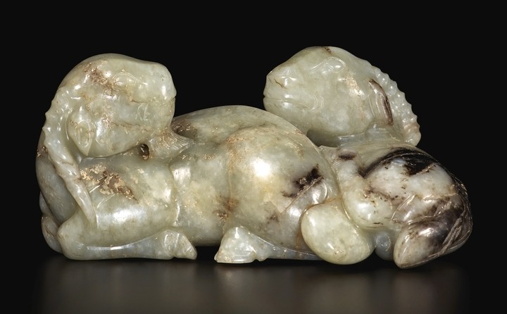 A RARE CELADON AND BROWN JADE 'DOUBLE RAM' GROUP YUAN / MING DYNASTY