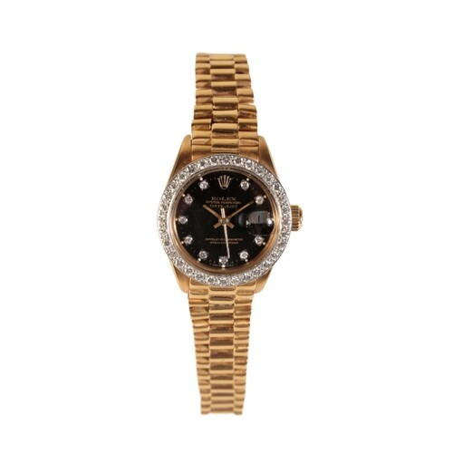 A ROLEX OYSTER PERPETUAL DATE JUST 18CT GOLD LADY'S BRACELET...