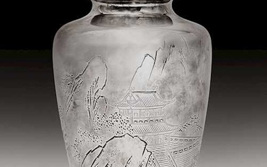 A SILVER VASE WITH CHASED AND ENGRAVED DECOR OF A LANDSCAPE.