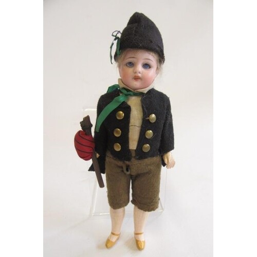 A Simon & Halbig bisque socket head boy doll with blue glass...