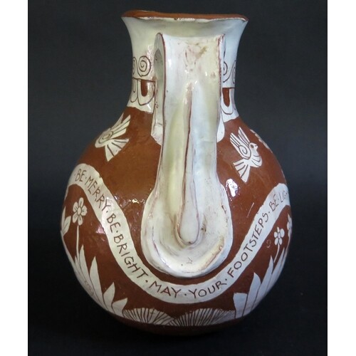 A Studio Pottery Jug with incised decoration of a couple dan...