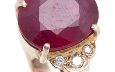 A TREATED RUBY AND DIAMOND RING; set in 9ct gold with a glass filled ruby between 6 round brilliant cut shoulder diamonds, size N1/2...