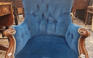 A VICTORIAN MAHOGANY ARM CHAIR BUTTON UPHOLSTERED IN BLUE VELVET