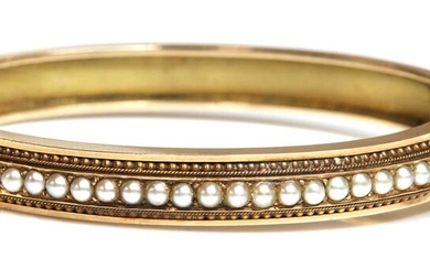 A Victorian Etruscan revival split pearl flat section hinged bangle, c.1870