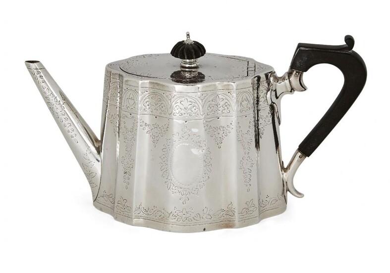 A Victorian silver teapot, London, c.1877, Frederick Elkington, of shaped oval form with floral engraved body and wooden handle, the hinged lid surmounted by lobed wooden finial, approx. 12 cm high (handle), approx. weight 12oz