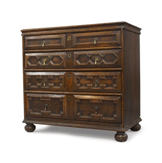 A William and Mary oak chest of drawers, late 17th century, two short over three long drawers, raised on bun feet, 95cm high, 99cm wide, 54cm deep