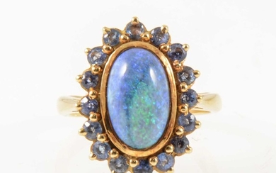 A black opal and sapphire dress ring.