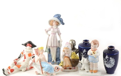 A box of decorative ceramics including lustred nursery fairings