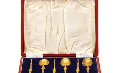 A cased set of six silver gilt anointing spoons