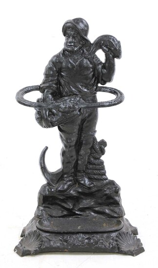 A cast-iron stick stand in the form of a fisherman