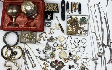 A collection of silver, unmarked white metal and costume...