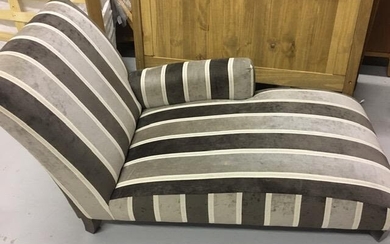 A contemporary chaise longue, upholstered in grey & white...