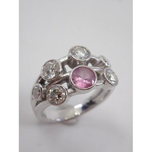 A diamond and pink sapphire cluster ring set 18ct gold finge...