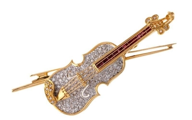 A diamond and ruby violin brooch/pendant, the pave diamond violin with diamond set pegs and calibre ruby finger board and bow detail, stamped 750, length 5cm