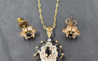 A diamond and sapphire oval cluster pendant set in gold plated silver mount and chain with a pair of