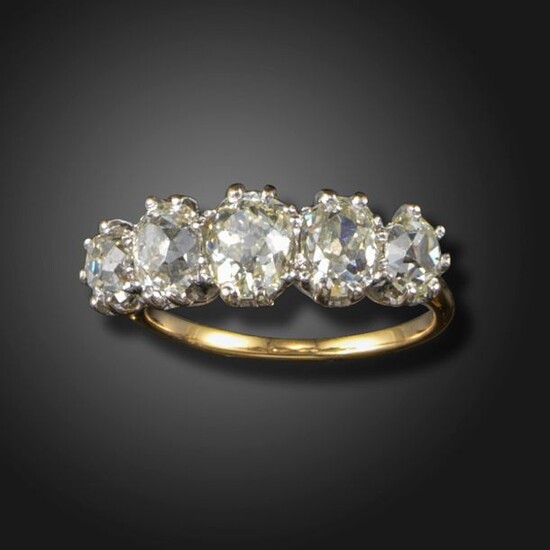 A diamond five-stone ring, claw-set with graduated old cushion-shaped diamonds...