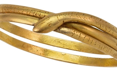 A double row bangle of serpent design, with engraved scale detail and crossover head, unmarked, inner circumference 19 cm, approximate gross weight 58g