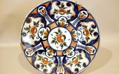 A good early 18th century Dutch delft charger decorated