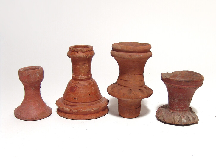 A group of 4 Islamic redware spout fragments