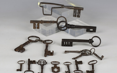 A group of mainly 17th and 18th century steel and iron keys, including an unusual folding key, exten