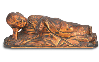 A lacquered wood reclining Buddha