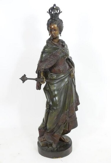 A large bronze depicting a female monarch with crown