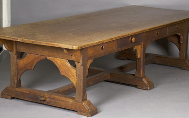 A large early 20th century Arts and Crafts oak refectory table, the rectangular top above eight frie