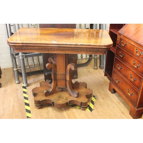 A late Regency rosewood fold over swivel top card table, 93c...