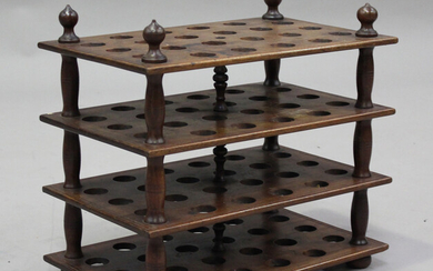 A late Victorian mahogany four-tier egg rack, pierced to hold eight-eight eggs, height 45cm, width 4