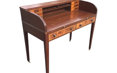 A mahogany Carlton House desk, the superstructure with shelves flanked...