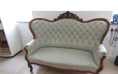 A mahogany framed settee with a buttoned back, nicely uphols...
