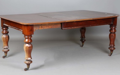 A mid-Victorian mahogany extending dining table, the top with a single extra leaf, raised on octagon