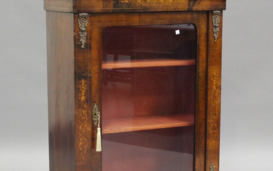 A mid-Victorian walnut and foliate inlaid pier cabinet with gilt metal mounts, fitted with a glazed