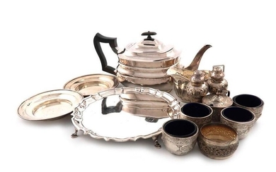 A mixed lot of silver items, comprising: a teapot, by William Hutton and Sons, London 1909, oblong form, a waiter, of circular form, Chester 1916, two dishes, a cream jug, a set of four salt cellars, a mustard pot, a pair of pepper pots, and an Indian...