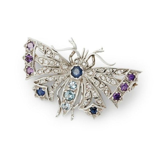 A multi-gem and diamond set brooch.