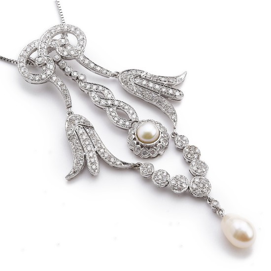 A necklace with a pearl and diamond pendant set with cultured pearls and numerous brilliant-cut diamonds, mounted in 18k white gold. L. app. 38 and 8 cm.