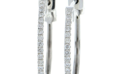 A pair of 18ct gold brilliant-cut diamond hoop earrings.