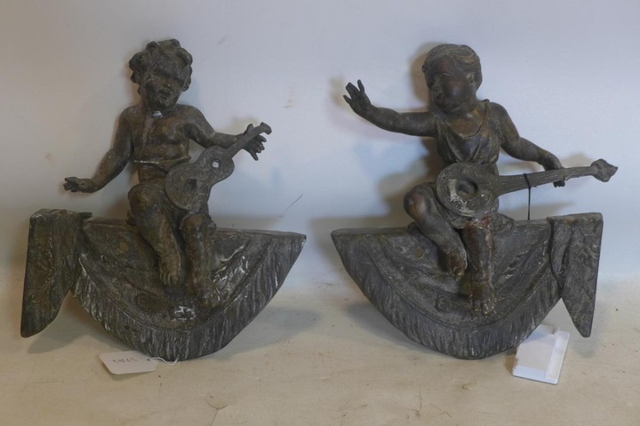 A pair of 19th century bronze finials in the form of child m...