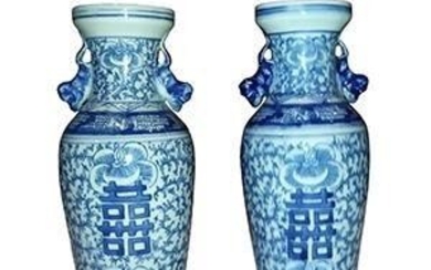 A pair of Chinese blue and white sweet pea motif vases with double happiness
