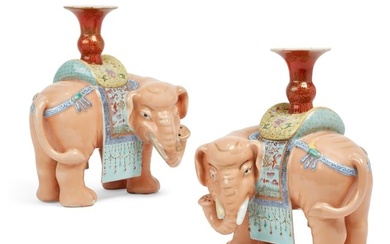 A pair of Chinese elephant form candle holders