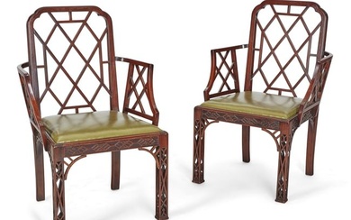 A pair of George III mahogany cockpen armchairs