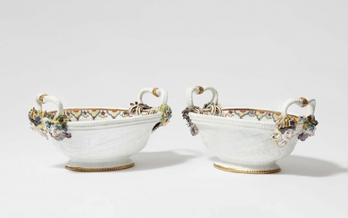 A pair of Meissen porcelain baskets with mascarons representing the seasons