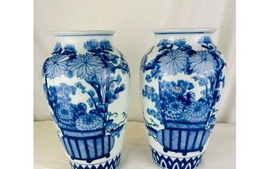A pair of blue and white oriental vases, 12''h
