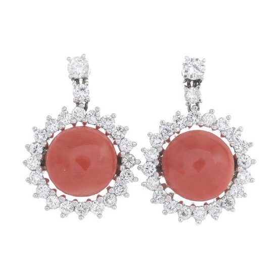 A pair of coral and diamond cluster earrings. Each