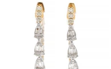 A pair of diamond ear pendants each set with numerous diamonds weighing a total of app. 1.22 ct., mounted in 18k gold and white gold. Diam. 22×26 mm. (2)