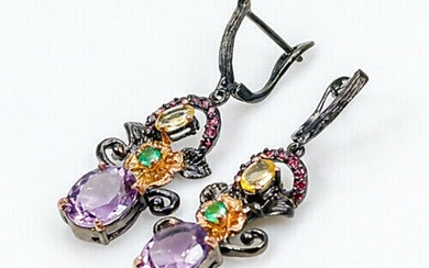 A pair of ear pendants each set with numerous oval and circular-cut amethysts, citrines, onyx and garnets, mounted in rhodium and gold plated silver.