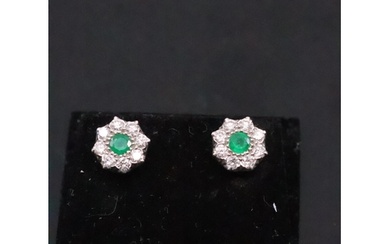 A pair of emerald and diamond cluster earrings set in 18ct g...