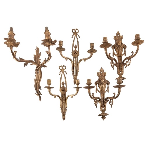 A pair of gilt metal twin light wall appliques in Louis XV /...