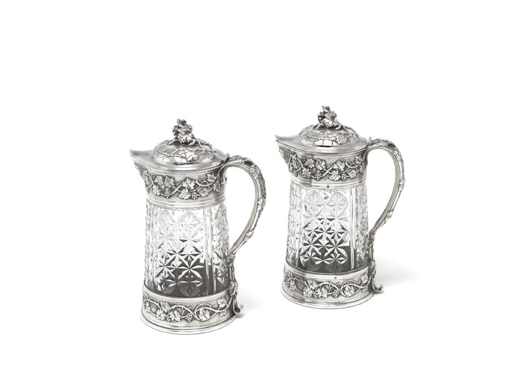 A pair of large French silver-mounted claret jugs
